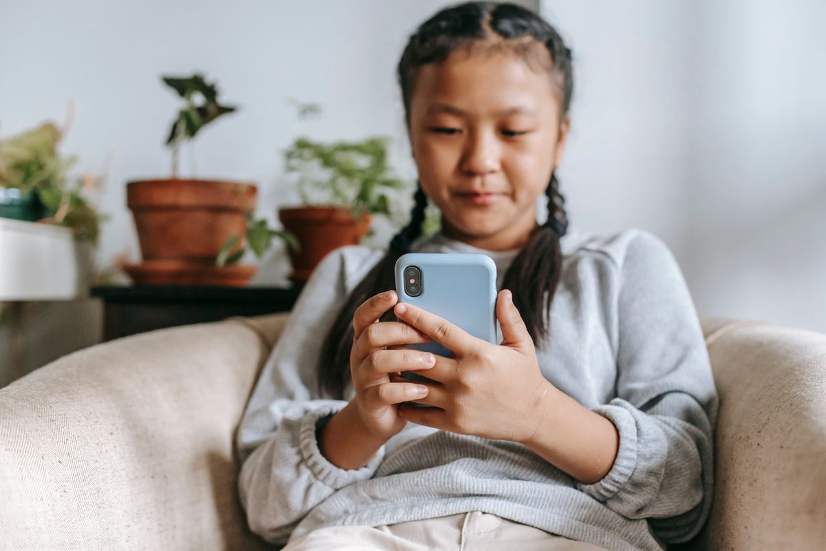 A child writing during a focused routine - Photo by Katerina Holmes on Pexels